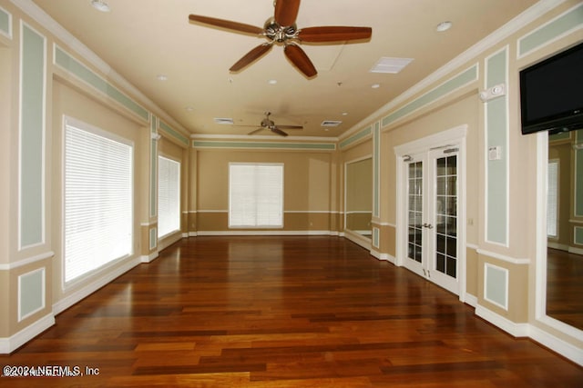 spare room with french doors, dark hardwood / wood-style flooring, ceiling fan, and ornamental molding