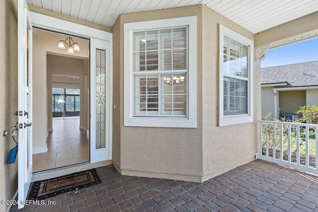 doorway to property featuring covered porch