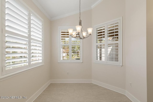 tiled spare room with a chandelier, ornamental molding, lofted ceiling, and a healthy amount of sunlight