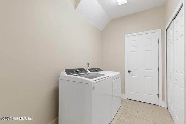 laundry room featuring washing machine and clothes dryer