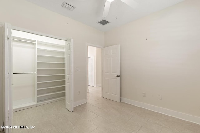 unfurnished bedroom featuring ceiling fan