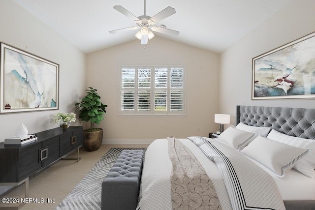 carpeted bedroom with ceiling fan and lofted ceiling