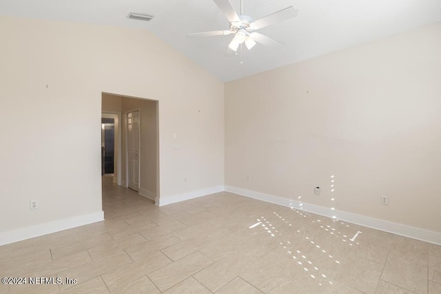 empty room featuring ceiling fan and lofted ceiling