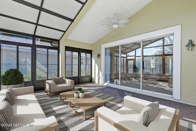 sunroom / solarium with ceiling fan, plenty of natural light, and lofted ceiling