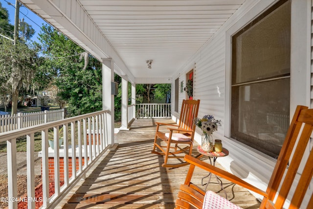 wooden deck featuring covered porch