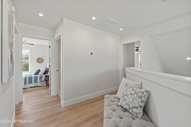 sitting room featuring ceiling fan and light hardwood / wood-style floors