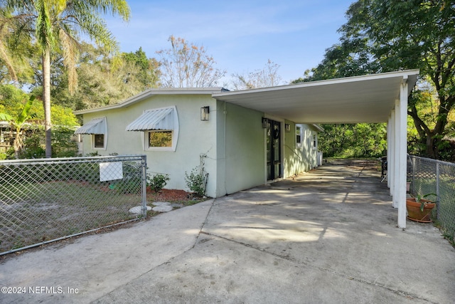 view of side of home featuring a carport