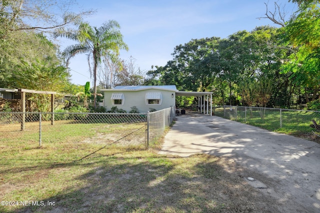 exterior space with a carport