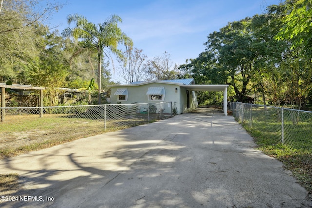 view of side of home featuring a carport