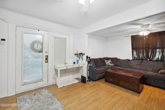 living room featuring ceiling fan, french doors, and light hardwood / wood-style floors