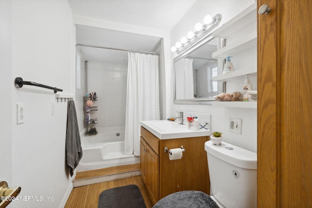 full bathroom with hardwood / wood-style flooring, vanity, toilet, and shower / tub combo