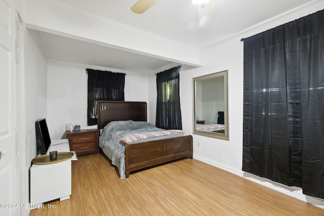 bedroom with hardwood / wood-style flooring and ceiling fan