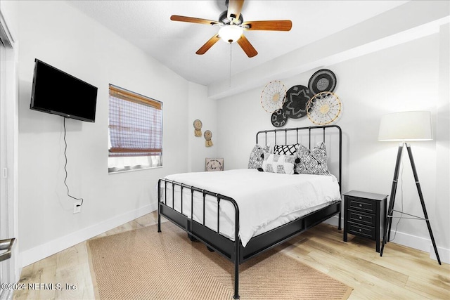 bedroom with hardwood / wood-style floors and ceiling fan