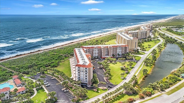 bird's eye view with a view of the beach and a water view