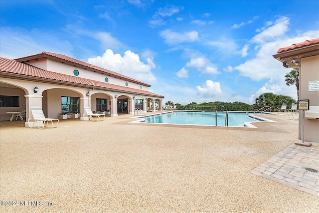 view of swimming pool featuring a patio area