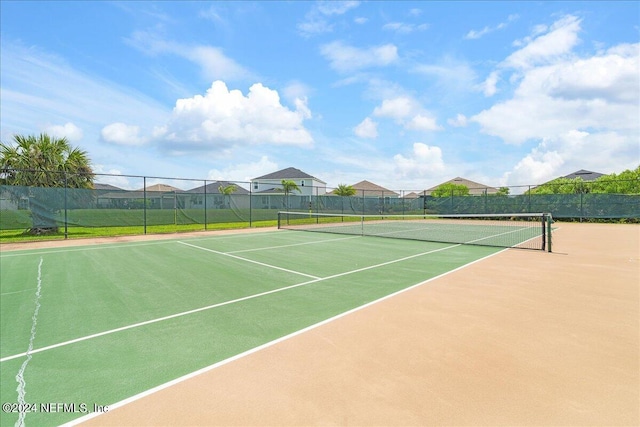 view of sport court featuring basketball hoop