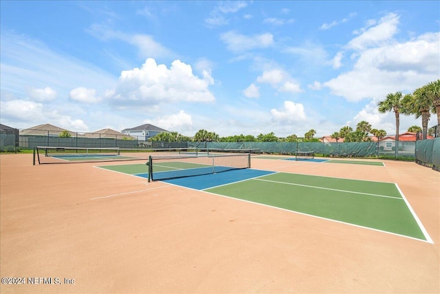 view of sport court featuring basketball hoop