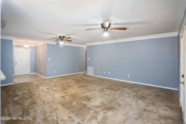 carpeted empty room with ceiling fan, crown molding, and a textured ceiling