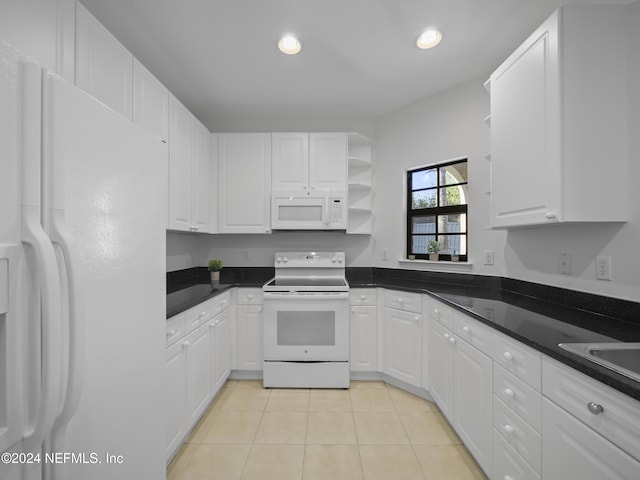 kitchen with white cabinetry, light tile patterned flooring, white appliances, and sink