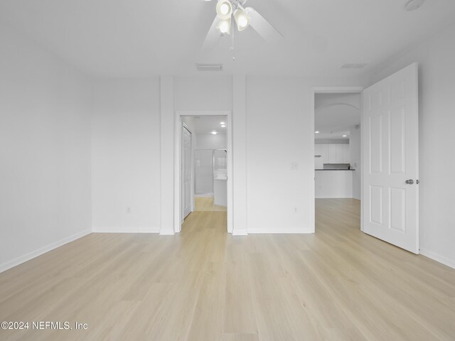 unfurnished bedroom with light wood-type flooring and ceiling fan