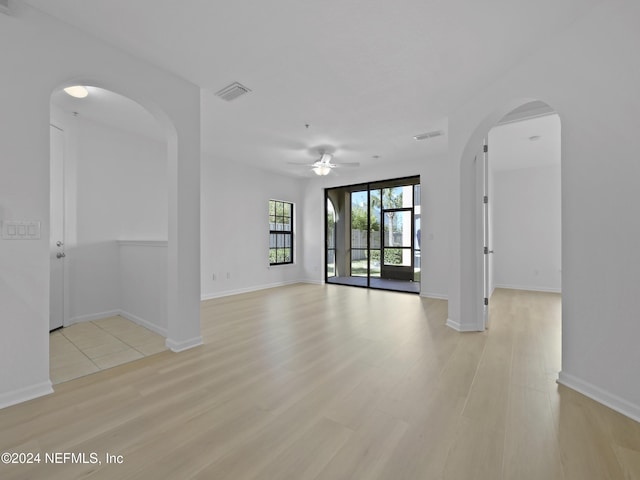 spare room featuring ceiling fan and light wood-type flooring