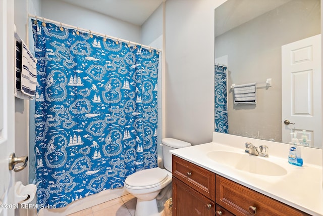 bathroom with tile patterned floors, vanity, and toilet