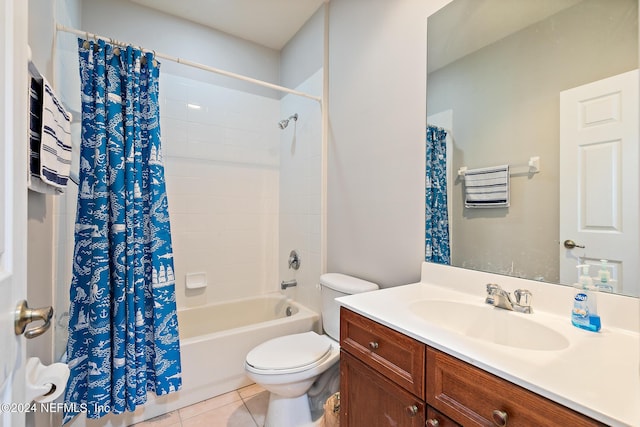 full bathroom featuring tile patterned flooring, shower / tub combo, vanity, and toilet