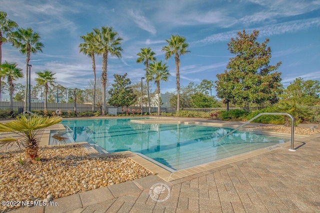 view of swimming pool featuring a patio area