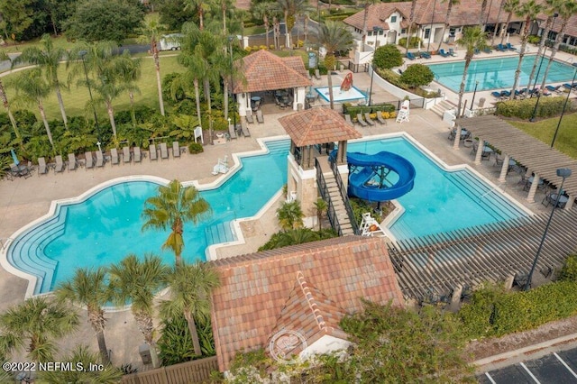 view of swimming pool featuring a gazebo and a water slide