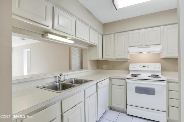 kitchen with sink, white cabinets, white appliances, and light tile patterned floors