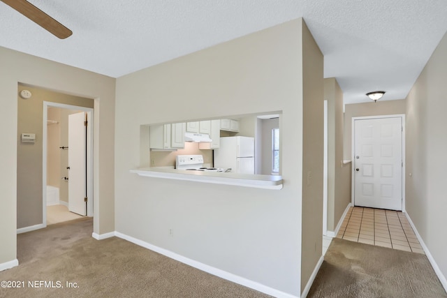 interior space featuring a textured ceiling and ceiling fan