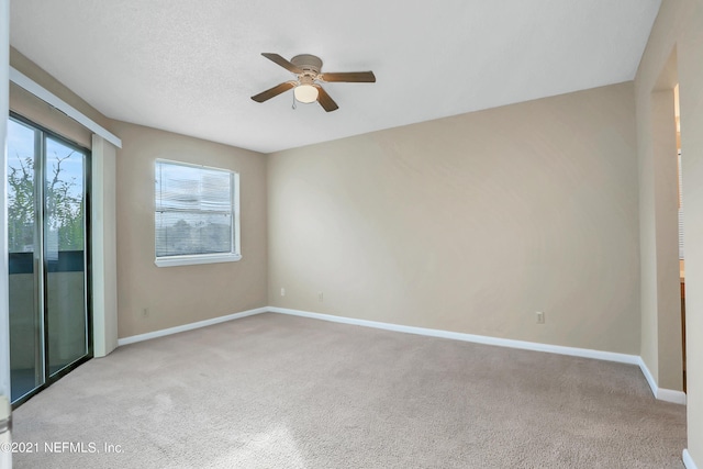 unfurnished room with light carpet and ceiling fan