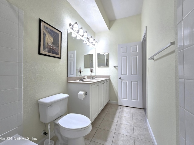 bathroom with tile patterned floors, vanity, and toilet