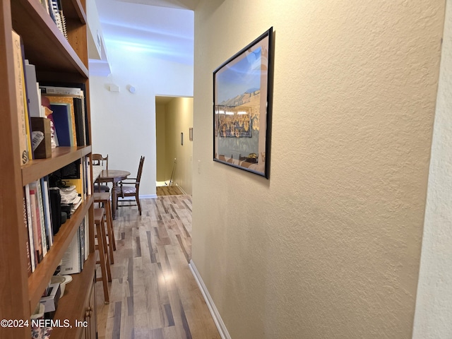 corridor featuring hardwood / wood-style floors