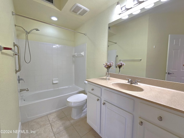 full bathroom featuring tile patterned flooring, vanity, toilet, and tiled shower / bath