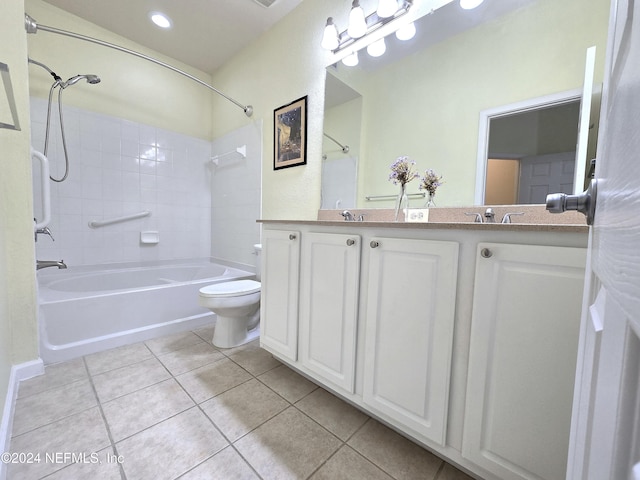 full bathroom featuring tile patterned flooring, vanity, tiled shower / bath combo, and toilet