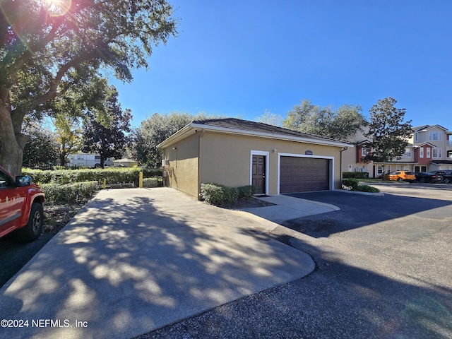 view of side of home with a garage