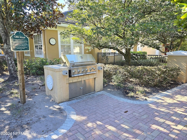 view of patio / terrace with area for grilling and a grill