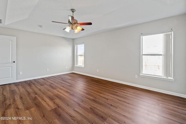 unfurnished room featuring ceiling fan and dark hardwood / wood-style flooring