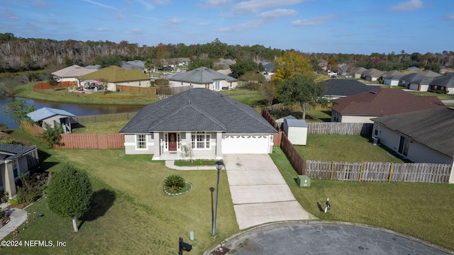 drone / aerial view featuring a water view