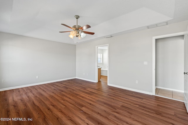 interior space with ceiling fan and dark wood-type flooring