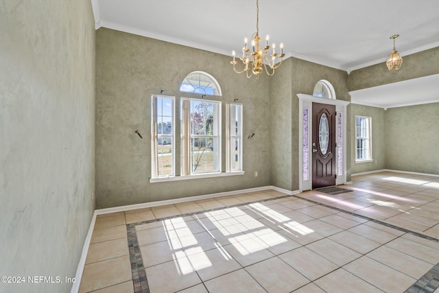 entryway with ornamental molding, a notable chandelier, and light tile patterned flooring