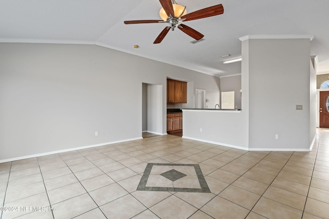 unfurnished living room with ceiling fan, ornamental molding, light tile patterned floors, and lofted ceiling