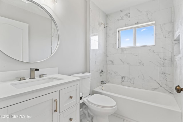 full bathroom with vanity, tiled shower / bath combo, and toilet