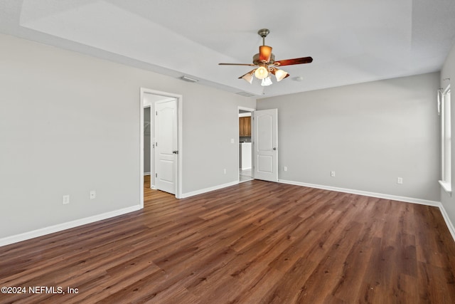 unfurnished bedroom featuring ceiling fan and dark hardwood / wood-style floors