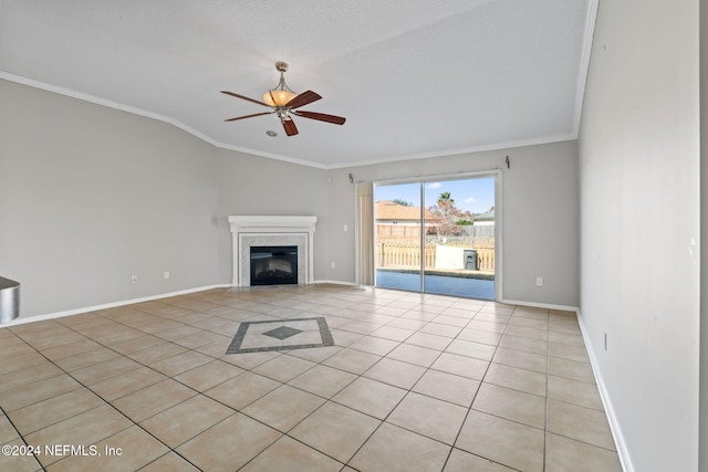 unfurnished living room featuring light tile patterned floors, vaulted ceiling, ceiling fan, and ornamental molding