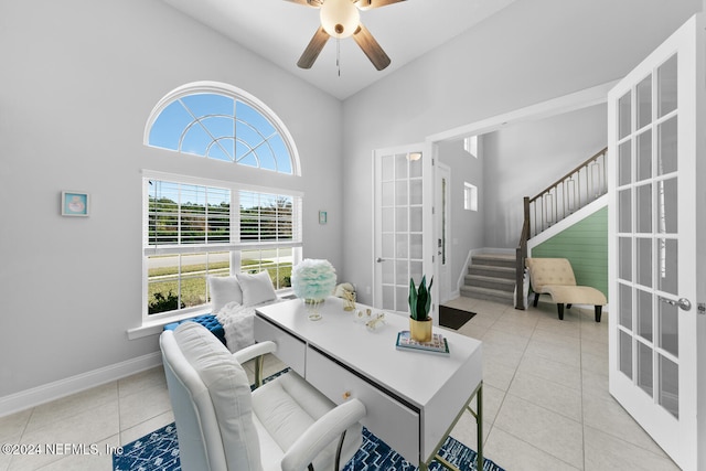 dining room with ceiling fan, french doors, high vaulted ceiling, and light tile patterned floors