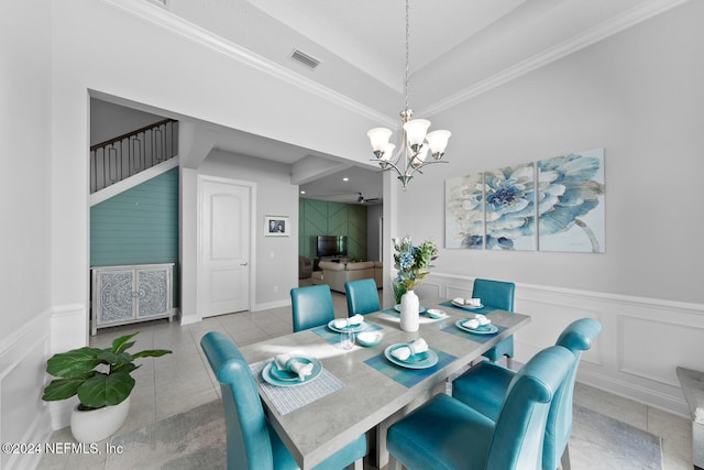 tiled dining area with crown molding and a notable chandelier