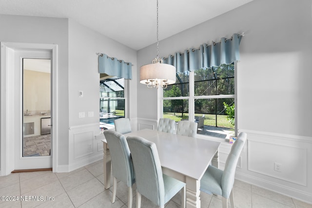 dining space featuring light tile patterned flooring