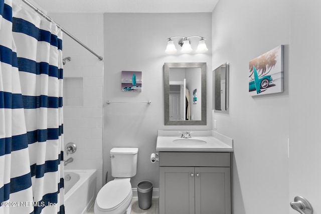 full bathroom featuring vanity, toilet, and shower / tub combo with curtain